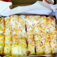 Cheezybread · Fresh-baked, bread strips with our signature three cheeses and garlic sauce, served with a s...