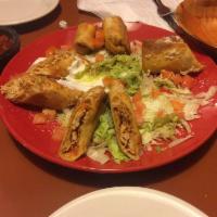 Chicken Taquitos · 2 flour tortillas stuffed with chicken and Monterey Jack cheese, rolled and crispy fried. Ga...