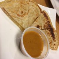 Roti Canai · Served with curry sauce. Add curry sauce for an additional charge.