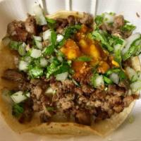 Carne Asada · Grilled steak with green onions comes with rice and beans. choice of flour or corn tortillas
