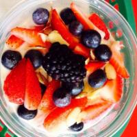 Oatmeal · With fresh berries, banana and almonds. Vegetarian.