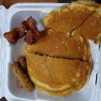 Blue Plate Special · 2 eggs, 2 strips of breakfast bacon, 2 sausage links and 2 pancakes.