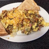 Meat Lovers Skillet · Bacon, ham, sausage, onions, green peppers and scrambled eggs mixed with home fries and topp...