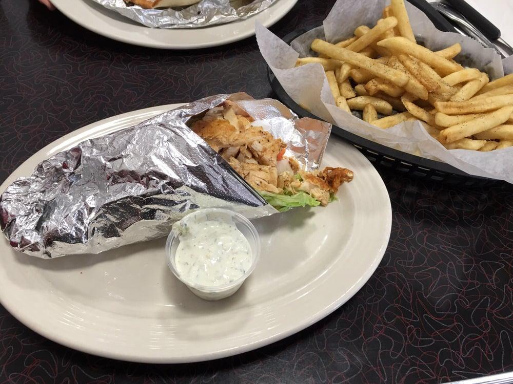 Chicken Gyro Plate · Marinated chicken grilled french fries and Greek salad, tzatziki sauce and pita bread.