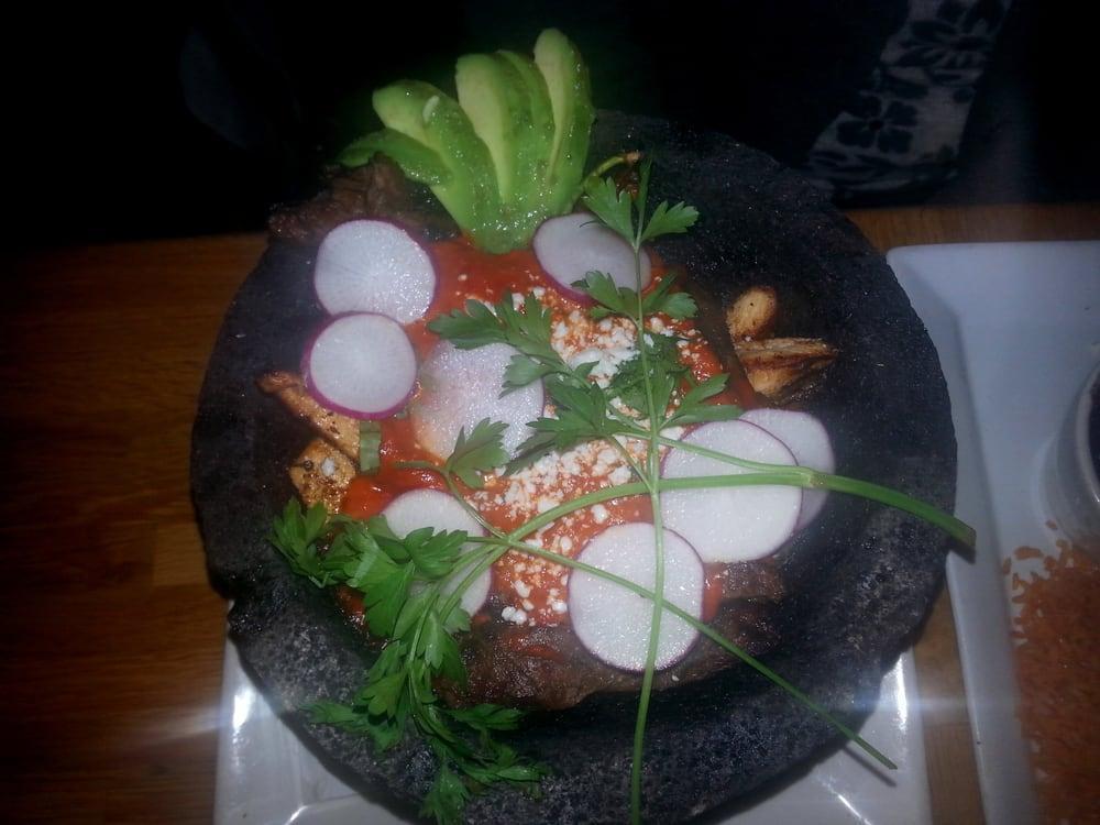 Molcajete · Steak, shrimp, chicken, relleno, and guajillo chili sauce slow cooked in a sizzling molcajete. Served with rice, beans, and tortillas. Gluten free.