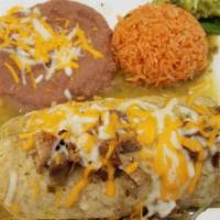 Chile Verde Burrito · Pork chile verde, rice and beans rolled in a large flour tortilla topped with green sauce an...