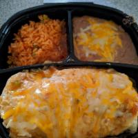 Champion Burrito · Chile relleno, grilled steak, rice and beans rolled in a large flour tortilla with ranchera ...