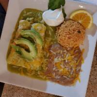 Shrimp and Crab Enchiladas · Two corn tortillas stuffed with shrimp, crab, cheese, bell pepper, and onion. Topped with cr...