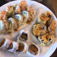 Crunch Roll · Base: Crab meat, shrimp tempura, avocado and cucumber. Top: Tempura flake.