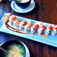 Beauty Dangerous Roll · Red ruby tuna, salmon, avocado, cucumber and topped with tuna, salmon and spicy sauce. 