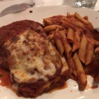 Eggplant Parmigiana · Baked with mozerella and parmigiana cheese.  served with a side of penne marinara
