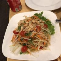 Papaya Salad · Som tum. Shredded green papaya with tomatoes, carrots, chili pepper and lime juice topped wi...
