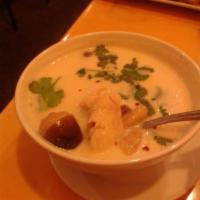 Tom Kha Soup · Slices of tender chicken, shrimp or tofu with mushroom in creamy coconut milk soup and toppe...