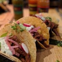 Carne Asada Tacos · 3 Tacos. Marinated grilled steak, pickled red onion and chimichurri crema.