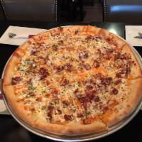 Chicken Bacon Ranch Pizza · Fried chicken cutlet, bacon, cheddar cheese, topped with ranch dressing. Round deep dish cru...