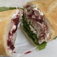 Giving Thanks Sandwich · Turkey, cream cheese and cranberry sauce with mayo, Dijon mustard, romaine lettuce, tomatoes...