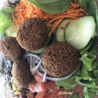 Falafel Salad · Hummus and olive tapenade, tomatoes, red onions, carrots, and cucumbers on mixed greens.