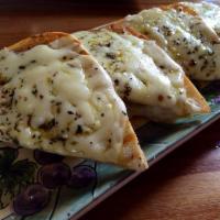 Three Cheese Focaccia · A prefect combination of 3 tasty cheeses; melted on rosemary bread.