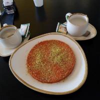 Kunafa · Baked cheese pastry, pistachios and rosewater syrup 