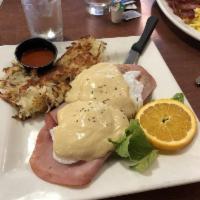 Eggs Benedict · Housemade hollandaise, 2 poached eggs and shaved ham on a toasted English muffin.