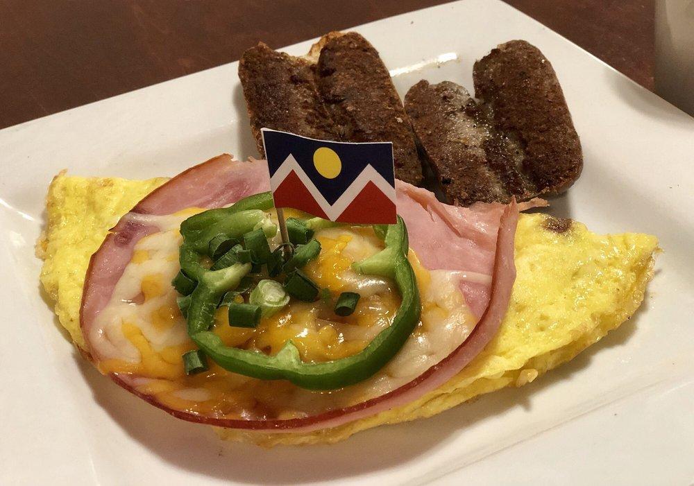 Denver Omelette · Named for the great city! Filled with ham, green peppers, onions, melted cheddar and scallions.