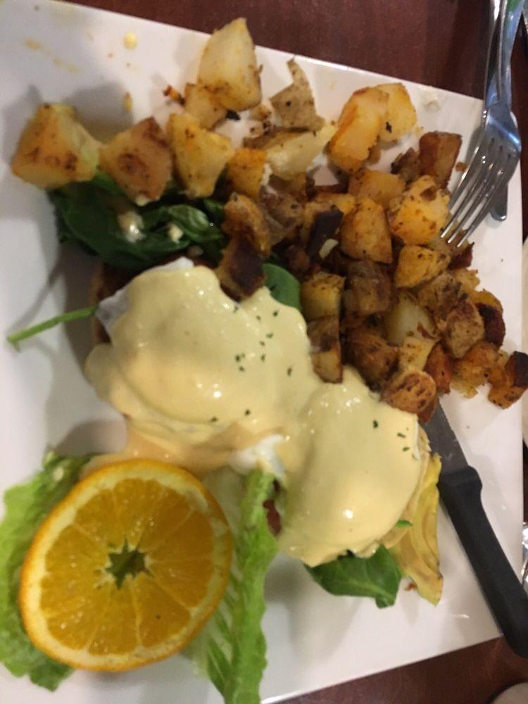 California Benedict · Housemade hollandaise, 2 poached egg, avocado, tomatoes and spinach on a toasted English muffin.