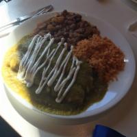 Enchiladas · 3 white meat chicken enchiladas topped with our delicious home made salsa, melted cheese and...