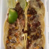 Alambre · 6 corn tortillas with pastor or bistec, bell peppers, onion, bacon and cheese.