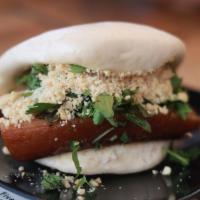 Traditional Pork Belly Bao · Tender pork belly braised in house special stew, mustard greens, cilantro, crushed peanuts.