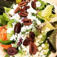 Greek Salad · Romaine lettuce, tomatoes, cucumbers, onions, green peppers, kalamata olives, pepperoncini a...