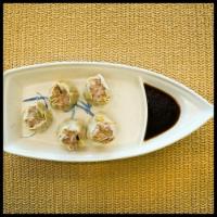 Pork Dumplings · 5 pieces. Steamed pork mixed with veggies wrapped in wonton skin. Served w/ Sweet Soy Sauce