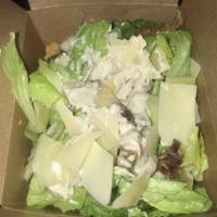 Caesar Salad · Crisp croutons, bacon bits and shaved Parmesan.