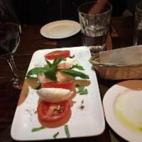 Caprese · Buffalo mozzarella, beefsteak tomatoes, basil and extra virgin olive oil.