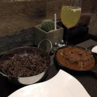 Ropa Vieja · Traditional Cuban pulled beef served with moror rice