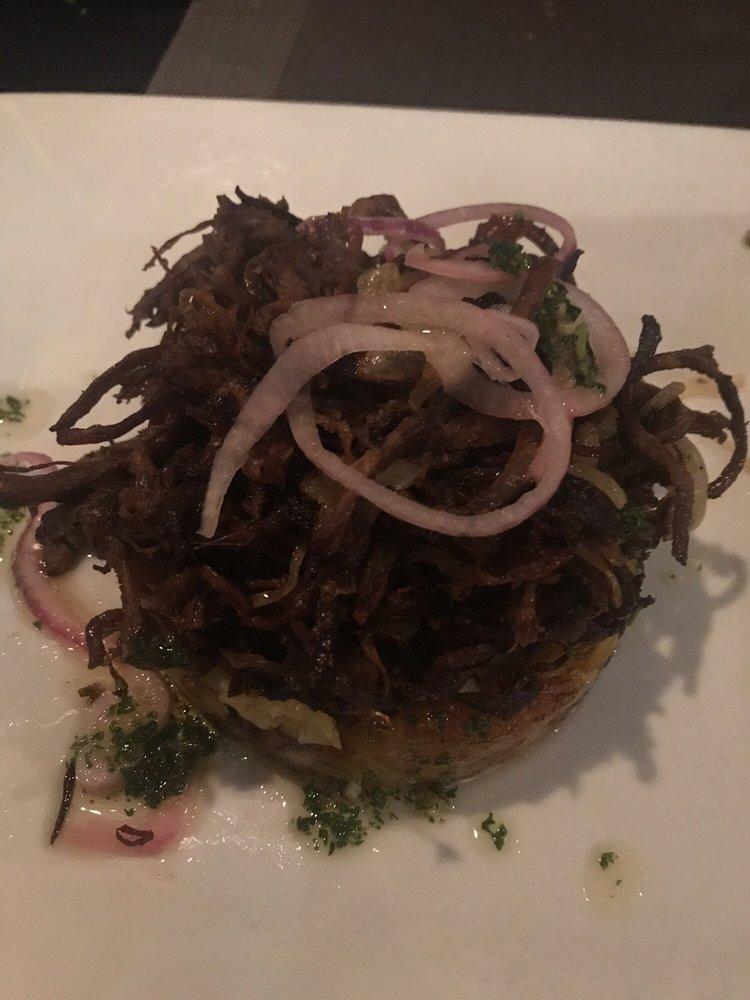 Vaca Frita · Shredded fried beef with onions, served with maduros and moro rice