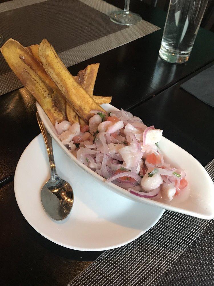 Ceviche · Seasonal fish marinated with lime juice and red onions, served with green plantain chips