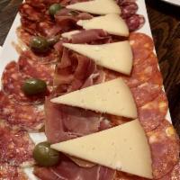 Tabla Surtida · Served with cured ham, sausages, manchego and olives.