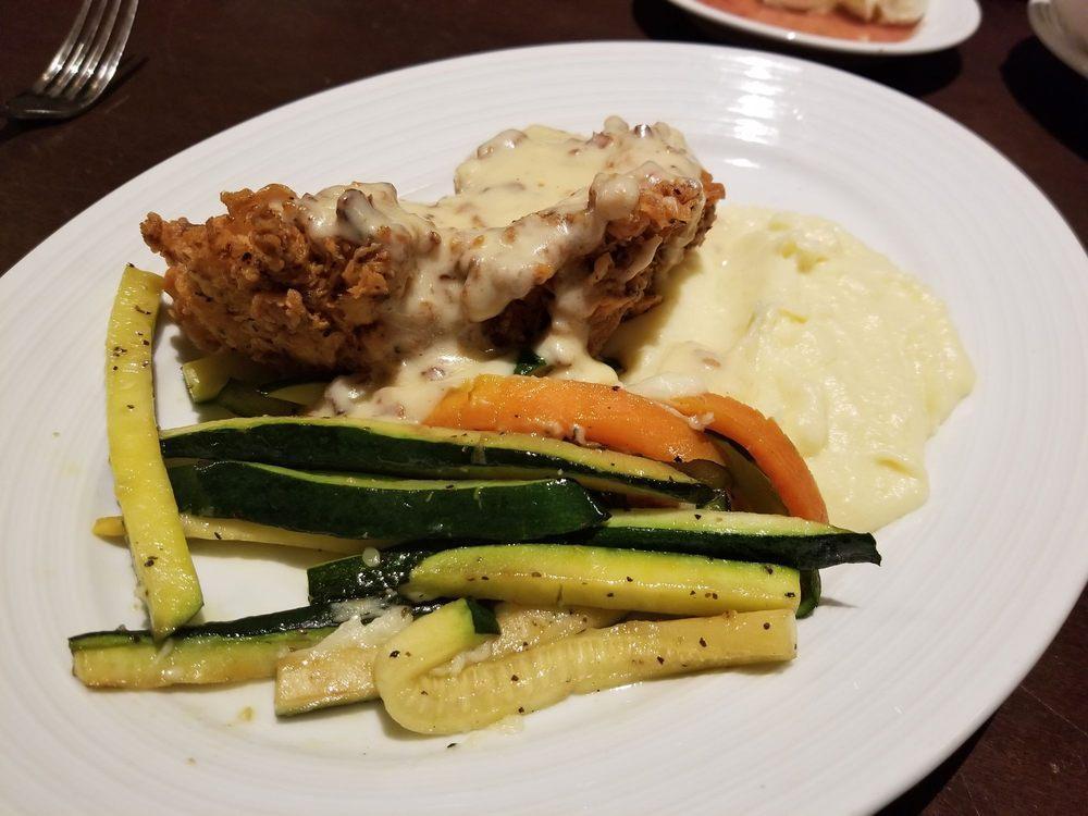 Fried Chicken · Jumbo Chicken Breast pounded thin and fried with a buttermilk sage batter.  Served with mashed potatoes and country gravy.