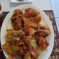 Kicking Fried Chicken · Perfectly crispy and seasoned chicken thigh. Deep-fried until golden brown. Served with swee...