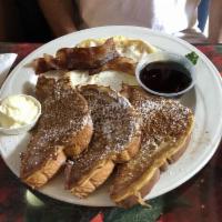 French Toast · Thick sliced egg bread, powdered sugar and cinnamon, syrup and butter.
