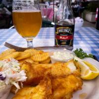 Fish and Chips · Pacific cod loins, hand dipped in beer batter, fried golden. Served with fries, coleslaw, ta...