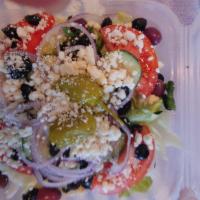 Greek Salad · Lettuce, onions, tomatoes, cucumbers, black olives, Kalamata olives, pepperoncini, and feta ...