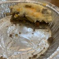Cottage Stout Pie · Hearty ground beef and fresh vegetables topped with garlic mashed potatoes then baked in the...