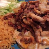 El Morro Special · Grilled chicken strips cooked with pineapple and Mexican pork sausage, topped with shredded ...