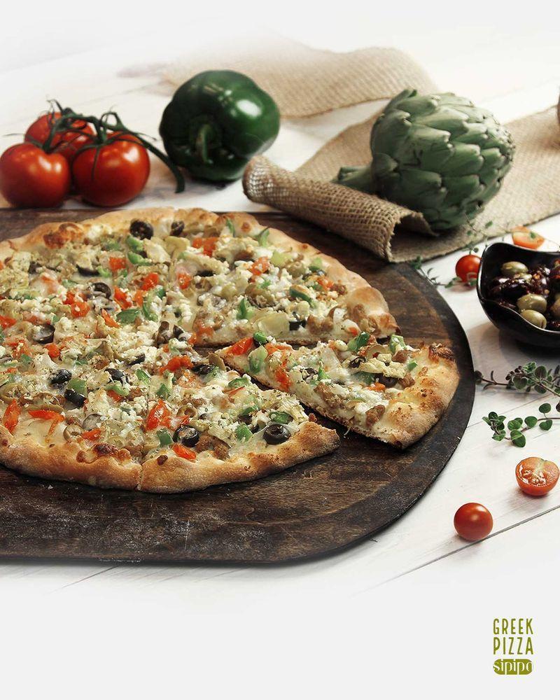 Greek Pizza · Olive oil, beef, tomatoes, feta, bell peppers, onions, black and green olives and artichokes.   