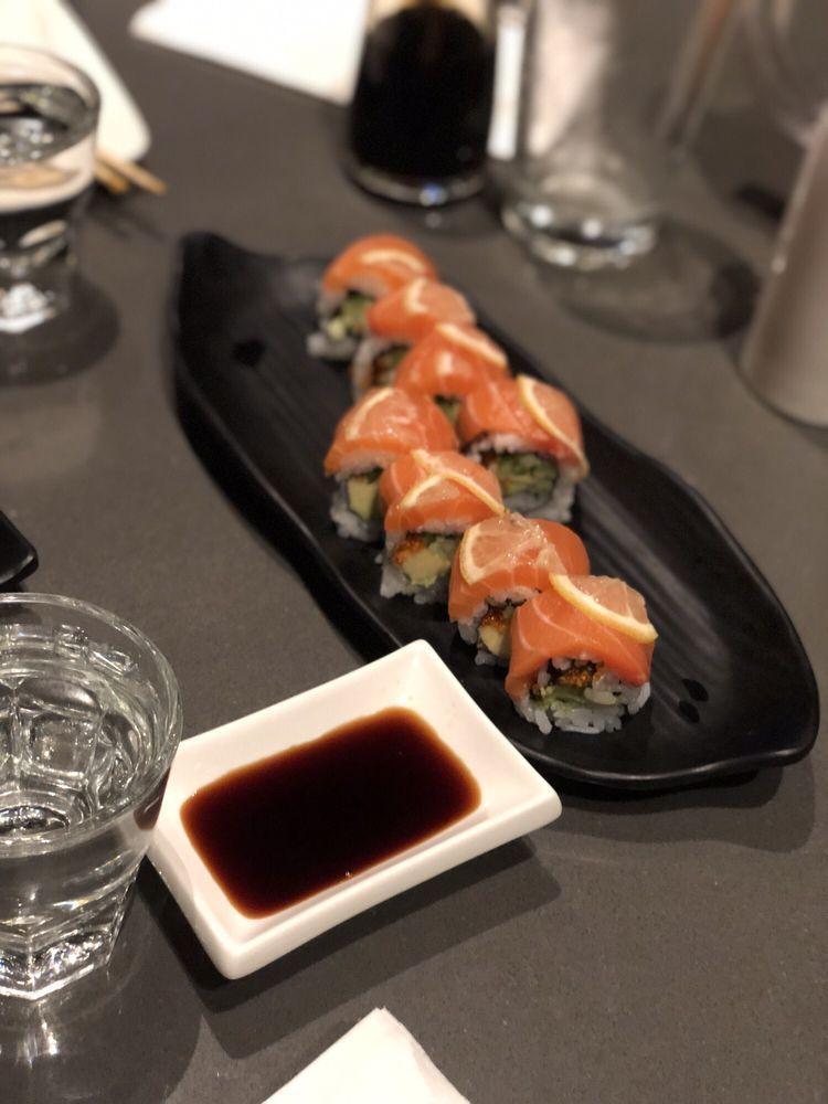 Lion King Roll · Baked salmon with garlic cream sauce and tobiko on top of California roll. 