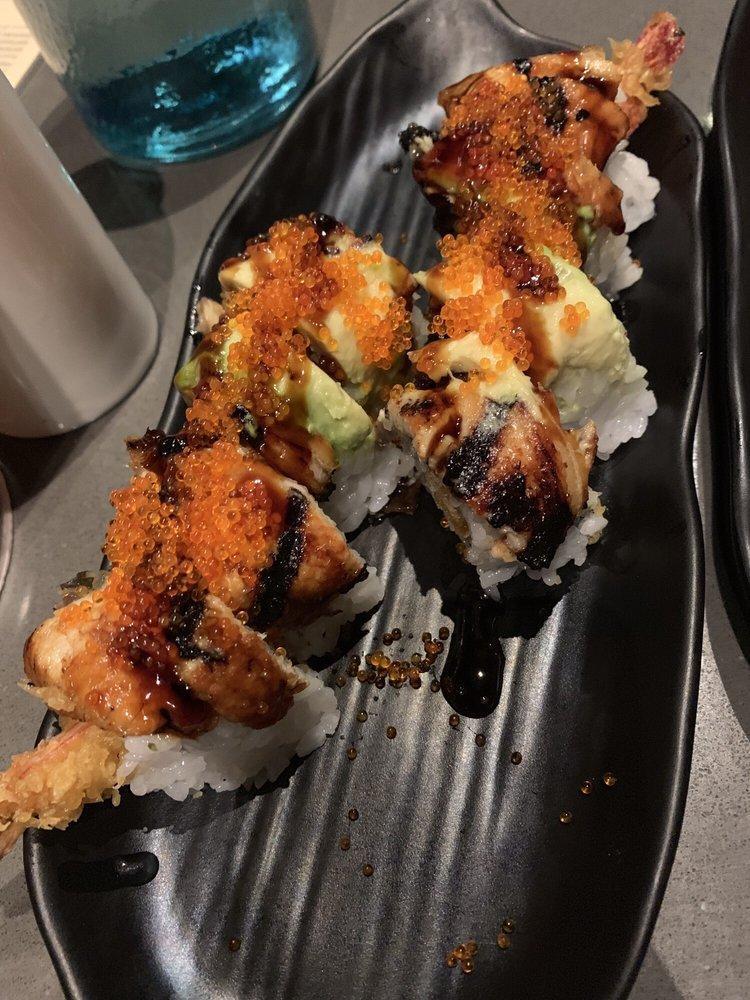 Dragon Roll · Shrimp tempura with BBQ eel, avocado and tobiko on top. 