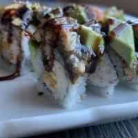 Dragon Roll · Shrimp tempura, cucumber, crab mix, eel, avocado, and eel sauce.