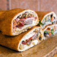 Stromboli · Your choice of spinach, sausage and peppers, chicken, or eggplant.