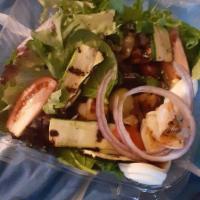 Greek Salad · Romaine lettuce, tomatoes, Kalamata olives, fresh feta cheese, stuffed grape leaves, and red...
